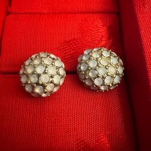 Baby blue and muted gold stud earrings. Approximately half inch in diameter.